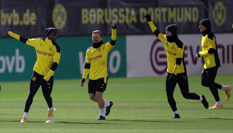 Left to right: Dortmund's Youssoufa Moukoko, Felix Passlack and Dortmund's Marco Reus. EPA