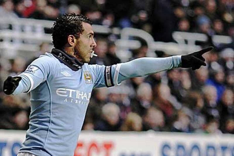 Tevez celebrates in his trademark style as if to silence his critics.