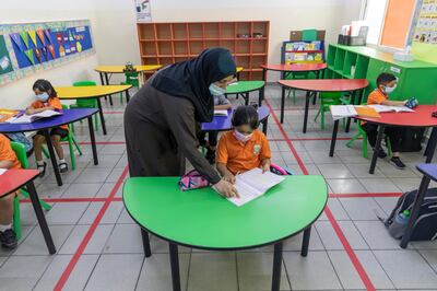 Pupils of Gulf Model School in grades one to 12 will have to maintain a one-metre distance between each other, while younger children have been placed in bubbles. Antonie Robertson / The National 

