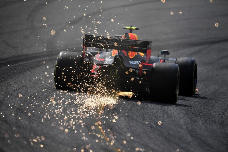 Sparks fly behind Pierre Gasly of France driving the Aston Martin Red Bull Racing RB15 on track during practice for the F1 Grand Prix of China at Shanghai International Circuit. Getty Images