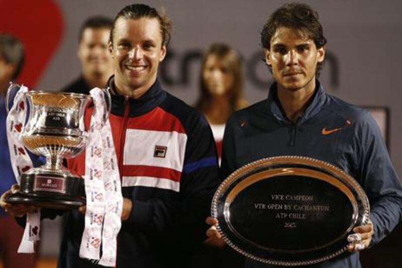 Horacio Zeballos and Rafael Nadal with their trophies after the VTR Open final in Chile.