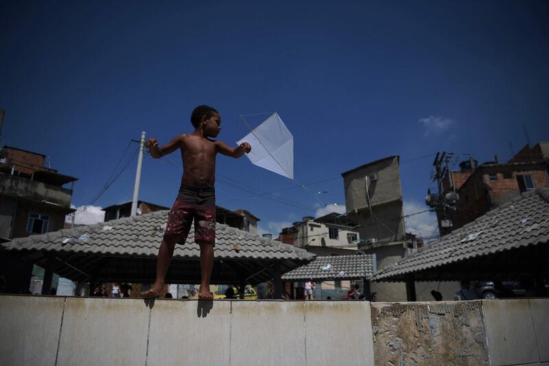 A boy flies a kite in the Mandela favela in Rio de Janeiro, Brazil. AFP