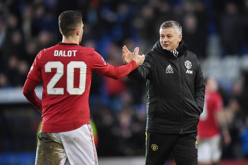 Manchester United manager Ole Gunnar Solskjaer, right, and Diogo Dalot. Getty