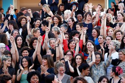 epa06731350 Actresses and female directors stand on the steps of the red carpet in protest of the lack of female filmmakers honored throughout the history of the festival at the screening of 'Girls of the Sun (Les Filles du Soleil)' during the 71st annual Cannes Film Festival, in Cannes, France, 12 May 2018. The movie is presented in the Official Competition of the festival which runs from 08 to 19 May.  EPA/FRANCK ROBICHON