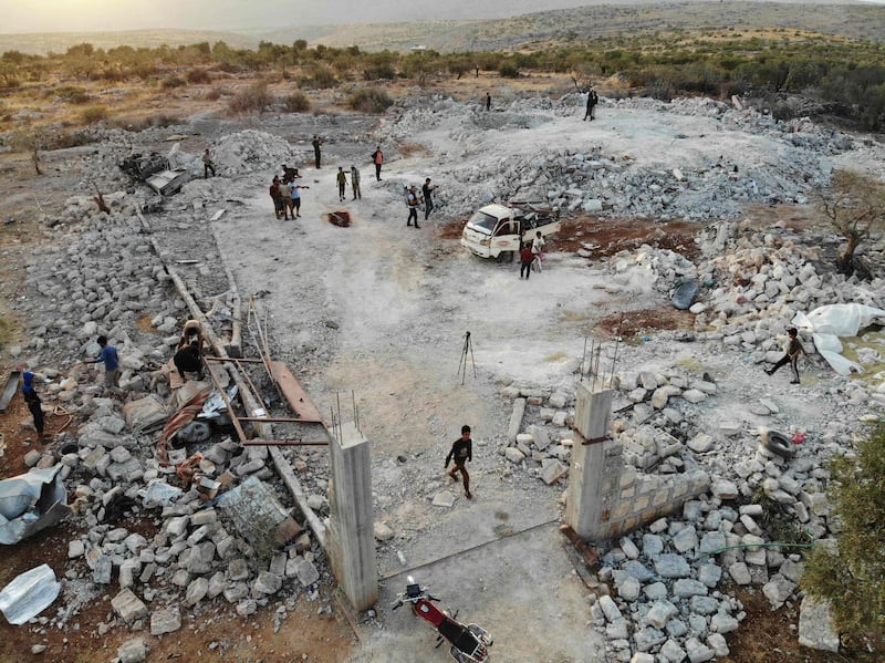 An aerial view taken on on October 27, 2019 shows the site that was hit by helicopter gunfire which reportedly killed nine people near the northwestern Syrian village of Barisha in the Idlib province along the border with Turkey, where "groups linked to the Islamic State (IS) group" were present, according to a Britain-based war monitor with sources inside Syria.  The helicopters targeted a home and a car on the outskirts of Barisha, the Syrian Observatory for Human Rights said, after US media said IS leader Abu Bakr al-Baghdadi was believed to be dead following a US military raid in the same province. Observatory chief Rami Abdel Rahman said the helicopters likely belonged to the US-led military coalition that has been fighting the extremist group in Syria. / AFP / Omar HAJ KADOUR
