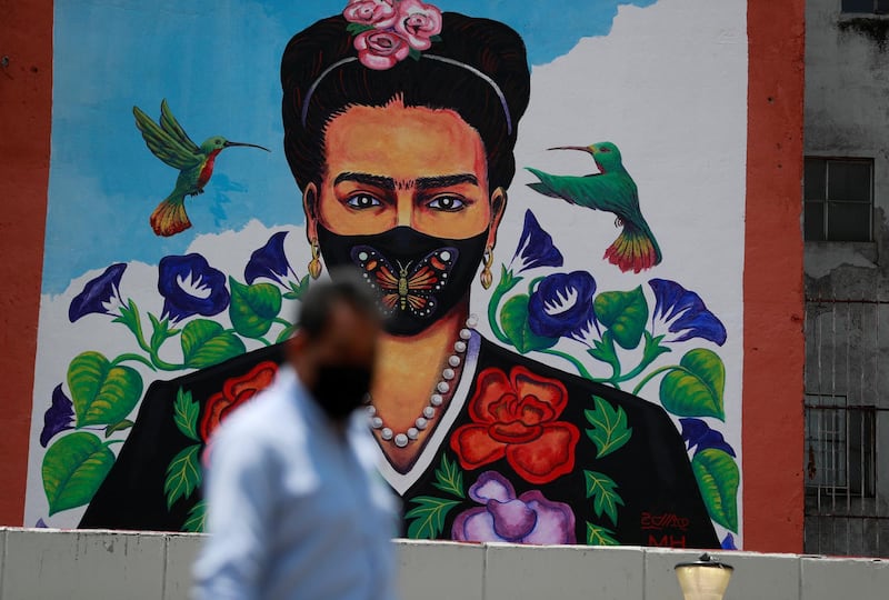 The mural of Frida Kahlo wearing a face mask is seen on a building wall in Mexico City, Mexico. Reuters