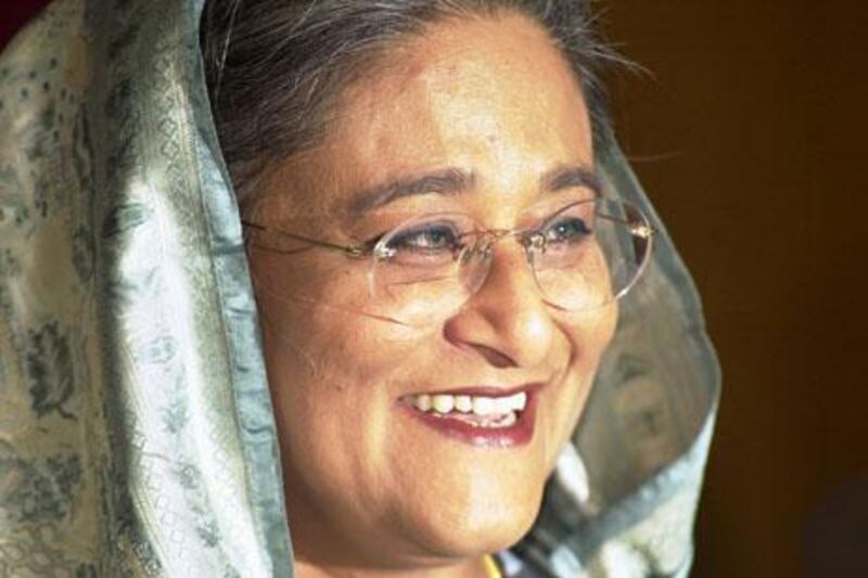 Former Bangladesh Prime Minister Sheikh Hasina smiles during a rally in Dhaka on Jan. 20, 2007. A court issued an arrest warrant against Hasina Sunday, April 22, 2007 her lawyer said, as she was poised to return to Bangladesh despite a warning from the military-backed government. (AP Photo/Pavel Raman)