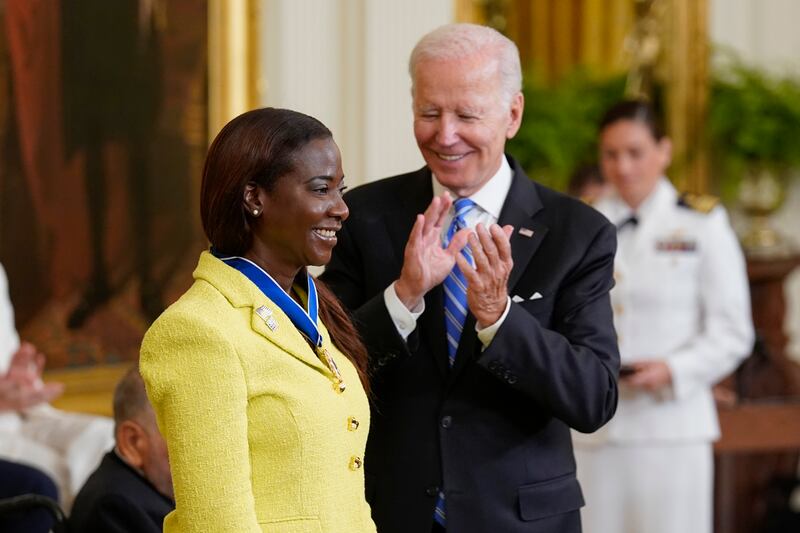 Mr Biden awards nurse Sandra Lindsay, the first person in the US to have the Covid-19 shot. AP