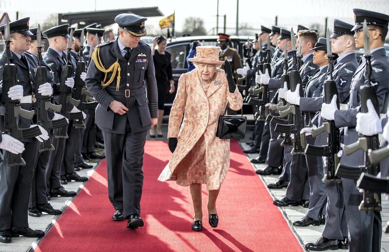 KING'S LYNN, ENGLAND - FEBRUARY 03: Queen Elizabeth II is escorted by Station commander Group captain James Beck past an RAF guard of honour as she arrives at RAF Marham to inspect the new integrated training centre that trains personnel on the maintenance of the new RAF F-35B Lightning II strike aircraft at Royal Air Force Marham on February 3, 2020 in King's Lynn, England. (Photo by Richard Pohle - WPA Pool/Getty Images)