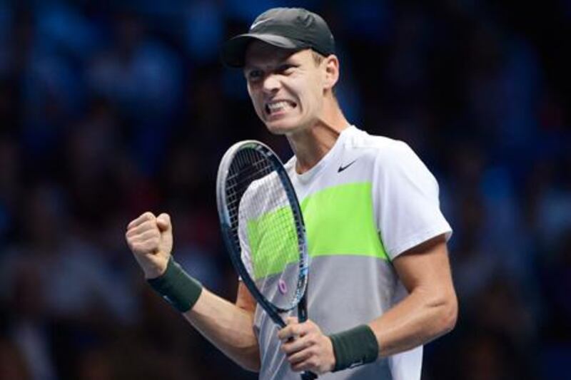 Tomas Berdych celebrates after defeating Jo-Wilfried Tsonga at the ATP Tour Finals