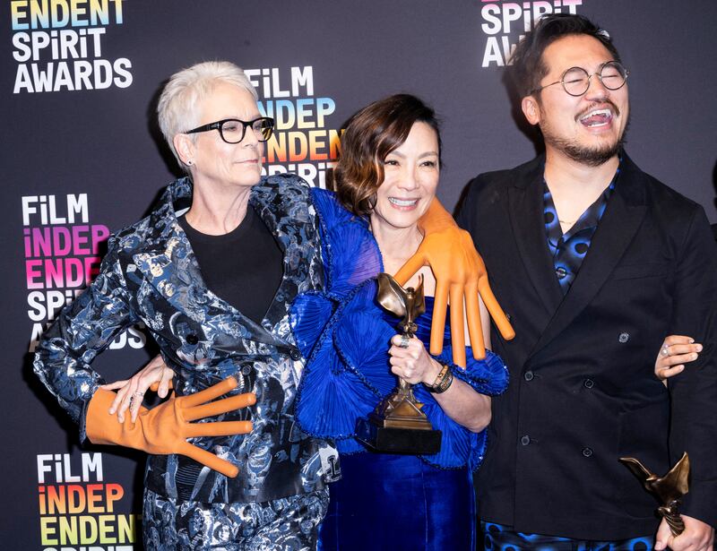 From left, Jamie Lee Curtis, Michelle Yeoh and Dan Kwan with the Best Feature Award for Everything Everywhere All at Once, at the 2023 Film Independent Spirit Awards. Reuters