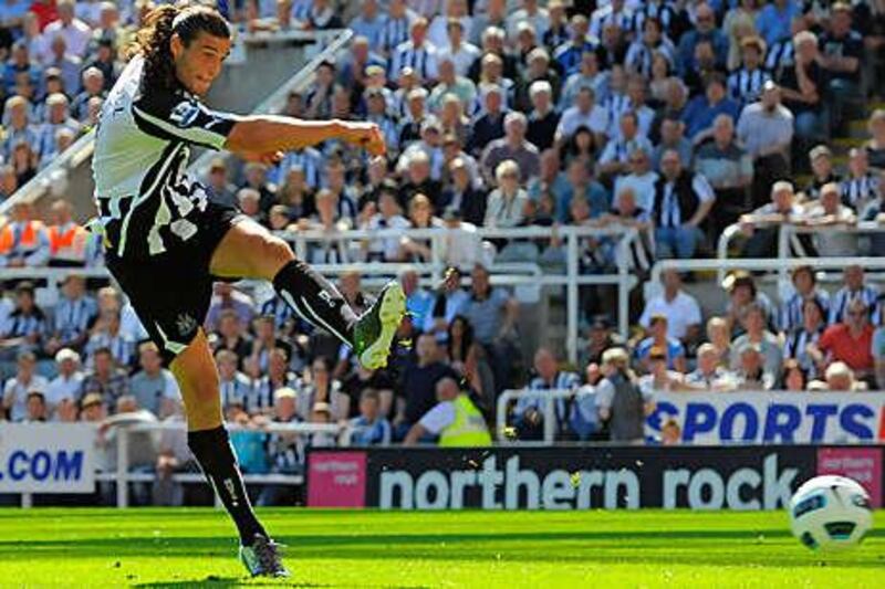 Andy Carroll scores his second for Newcastle.