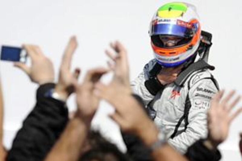 Rubens Barrichello enjoys the applause after winning the European Grand Prix in Valencia.