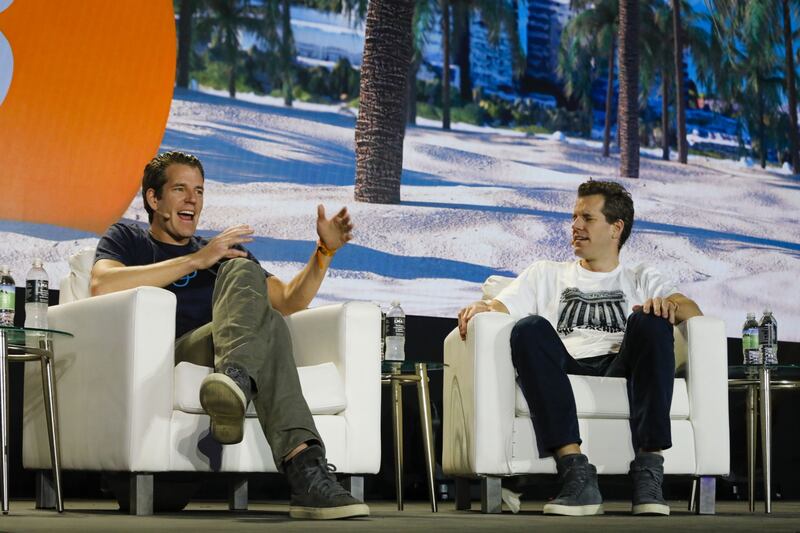 Tyler Winklevoss, chief executive and co-founder of Gemini Trust, left, and Cameron Winklevoss, president and co-founder of Gemini Trust, have a net worth of $4bn each. Bloomberg