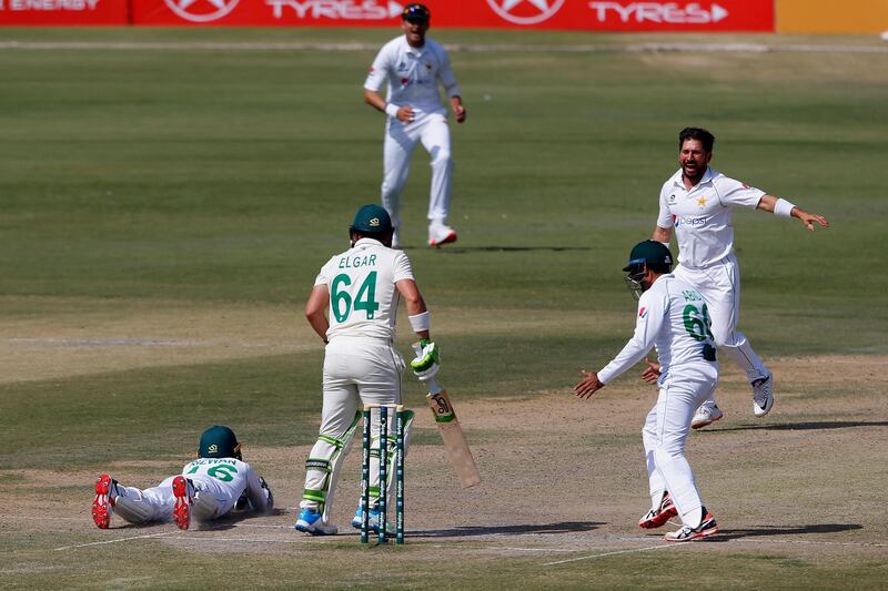 Pakistan's Yasir Shah celebrates after taking the wicket of Dean Elgar. (AP Photo/Anjum Naveed)