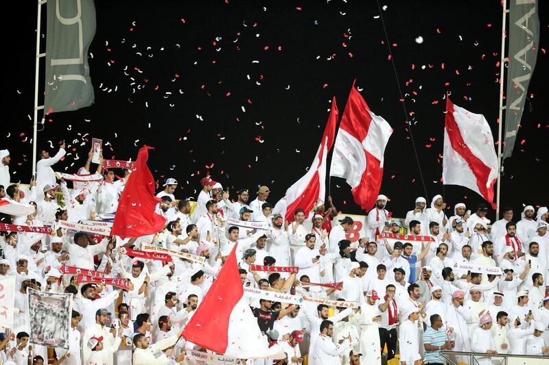 Dubai, United Arab Emirates - May 11, 2019: Football. Sharjah fans during the game between Al Wasl and Sharjah in the Arabian Gulf League. Saturday the11th of May 2019. Al Wasl Football club, Dubai. Chris Whiteoak / The National