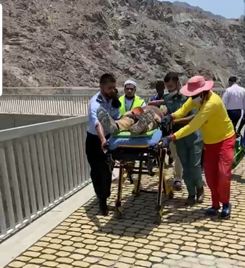 Two tourists, one of whom was flown to hospital via air ambulance, were rescued from a mountain in Khor Fakkan on Friday. Courtesy: Sharjah Police