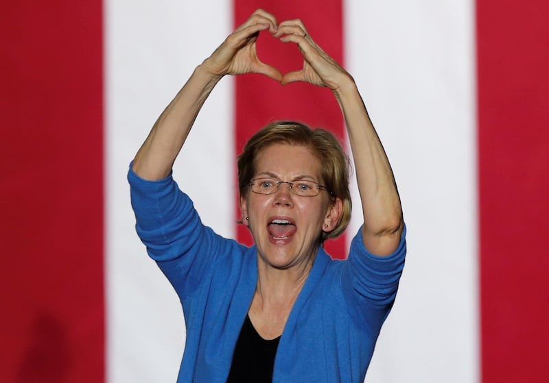 Democratic U.S. presidential candidate Senator Elizabeth Warren makes a heart gesture as she addresses supporters at her Super Tuesday night rally in Detroit, Michigan, U.S. REUTERS