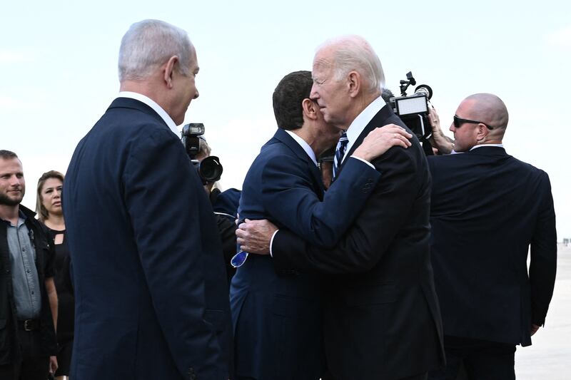 Israeli President Isaac Herzog greets US President Joe Biden at Tel Aviv's Ben Gurion Airport on October 18. AFP