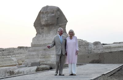 Britain's Prince Charles and his wife Camilla, Duchess of Cornwall, pose in front of the Sphinx as they visit the pyramids in Giza. EPA