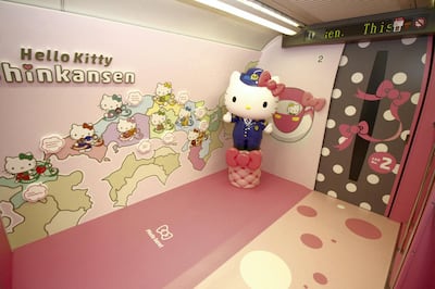This handout picture taken on June 25, 2018 and released by West Japan Railway on June 26, 2018 shows a photo spot inside a Shinkansen train for passengers to pose with popular character Hello Kitty, as seen at the Hakata car maintenance center in Fukuoka prefecture.
Resplendent in shocking pink, a sleek "Hello Kitty" bullet train, complete with special carriages festooned with images of the global icon from Japan, has been unveiled before chugging into service this week starting June 25. / AFP PHOTO / West Japan Railway / Handout / -----EDITORS NOTE --- RESTRICTED TO EDITORIAL USE - MANDATORY CREDIT "AFP PHOTO / West Japan Railway" - NO MARKETING - NO ADVERTISING CAMPAIGNS - DISTRIBUTED AS A SERVICE TO CLIENTS - NO ARCHIVES