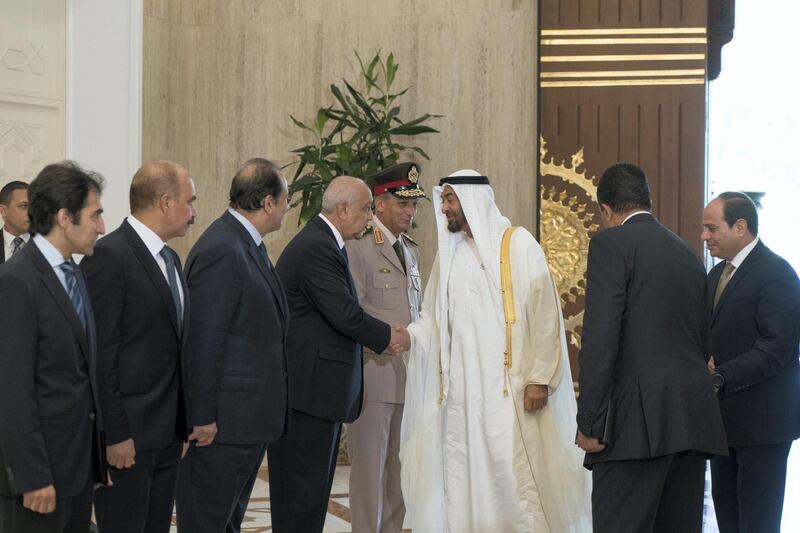 CAIRO, EGYPT - August 07, 2018: HH Sheikh Mohamed bin Zayed Al Nahyan Crown Prince of Abu Dhabi Deputy Supreme Commander of the UAE Armed Forces (3rd R), greets a guest, at the Heliopolis Palace. Seen with HE Abdel Fattah El-Sisi President of Egypt (R).
( Rashed Al Mansoori / Crown Prince Court - Abu Dhabi )
---