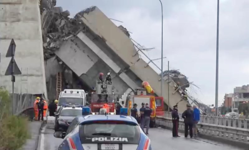 Rescue workers investigate the Morandi Bridge, which collapsed on August 14. Reuters TV