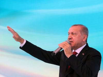 Turkey's President Recep Tayyip Erdogan, delivers a speech at his ruling Justice and Development Party (AKP) congress in Ankara, Turkey, Saturday, Aug. 18, 2018. Erdogan said his country will stand strong against an "attempted economic coup" amid heightened tensions with the United States. (Presidential Press Service via AP, Pool)