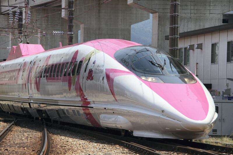 This handout picture taken on June 25, 2018 and released by West Japan Railway on June 26, 2018 shows a Shinkansen train adorned with special livery bearing popular character Hello Kitty, at the Hakata car maintenance centre in Fukuoka prefecture.
Resplendent in shocking pink, a sleek "Hello Kitty" bullet train, complete with special carriages festooned with images of the global icon from Japan, has been unveiled before chugging into service this week starting June 25. / AFP PHOTO / West Japan Railway / Handout / -----EDITORS NOTE --- RESTRICTED TO EDITORIAL USE - MANDATORY CREDIT "AFP PHOTO / West Japan Railway" - NO MARKETING - NO ADVERTISING CAMPAIGNS - DISTRIBUTED AS A SERVICE TO CLIENTS - NO ARCHIVES
