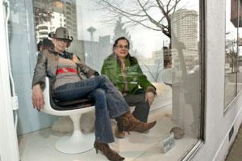 Mari Franke, left, on an Eero Aarnio chair, with her daughter, Rae McCullough, in the window of their shop in Seattle.