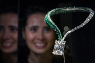 epa06316301 A Christie's employee looks over a necklace suspending a 163.41-carat, D colour flawless, IIA type diamond during a preview at Christie's auction house in Geneva, Switzerland, 08 November 2017. The necklace is estimated to fetch about 30 millions US dollars at auction that will take place in Geneva on 14 November.  EPA/MARTIAL TREZZINI
