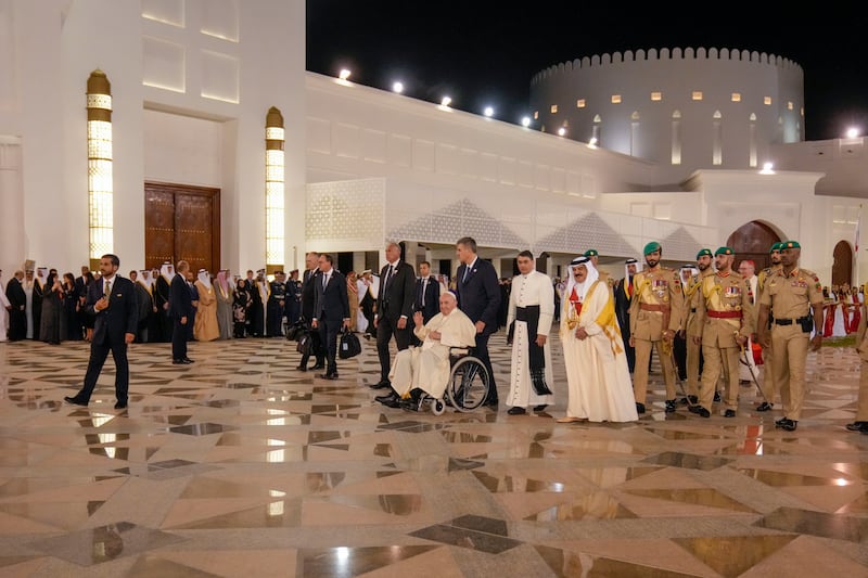 Pope Francis talks with King Hamad as he leaves the palace.  AP Photo