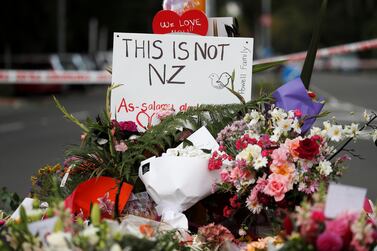 Flowers and signs were laid at a memorial to victims of the mosque attacks near Linwood mosque in Christchurch. Reuters