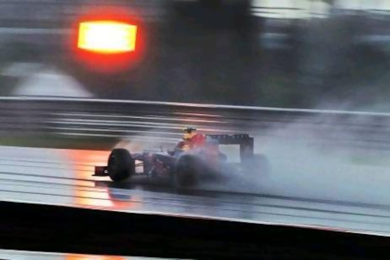 Mark Webber tackles the wet conditions in Malaysia.