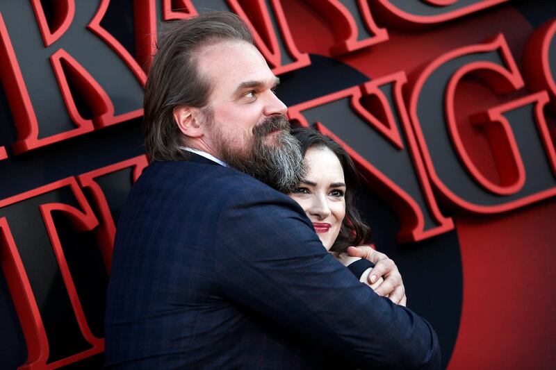 Stars of the series Winona Ryder (right) and David Harbour pose for photos on the red carpet prior to the premiere of 'Stranger Things: Season 3' in Santa Monica.  EPA