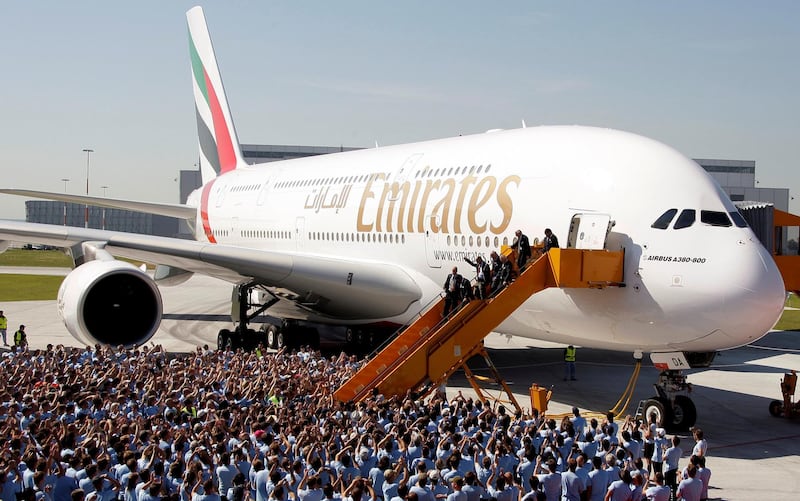 FILE PHOTO: Airbus CEO Tom Enders, Sheikh Ahmed bin Saeed al-Maktoum, chairman and chief executive of Emirates Airlines Group, and Louis Gallois, CEO of European Aeronautic Defence and Space company (EADS), disembark from an A380 aircraft during a handover ceremony in Hamburg, July 28, 2008.  REUTERS/Tobias Schwarz/File Photo