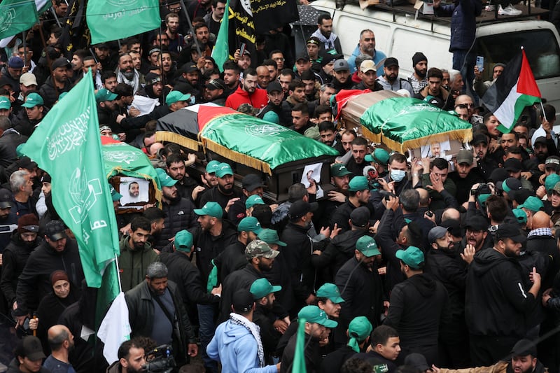 Mourners gather during the funeral. Reuters