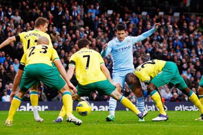 Even with what seems like the entire Norwich City defence around him, Sergio Aguero, centre, could not be stopped.