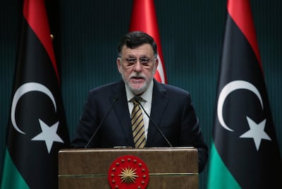 FILE - In this June 4, 2020 file photo, Fayez Sarraj, the head of Libya's internationally-recognized government, speaks at a joint news conference with Turkey's President Recep Tayyip Erdogan, in Ankara, Turkey.  Libyaâ€™s U.N.-supported government announced a cease-fire across the country and called for demilitarizing the strategic city of Sirte, which is controlled by rival forces. In a separate statement Friday, Aug. 21. (Turkish Presidency via AP, Pool)