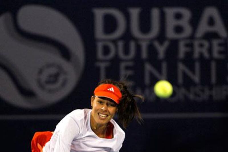 Ana Ivanovic held her cool in the second set, despite a fightback from Francesca Schiavone, to win her first-round match in Dubai.