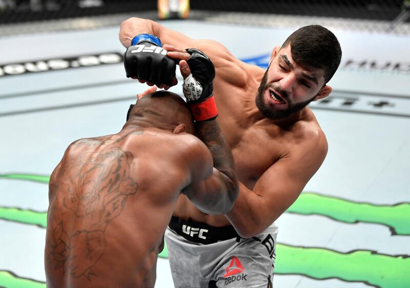 ABU DHABI, UNITED ARAB EMIRATES - JULY 19: (R-L) Amir Albazi of Iraq punches Malcolm Gordon of Canada in their bantamweight bout during the UFC Fight Night event inside Flash Forum on UFC Fight Island on July 19, 2020 in Yas Island, Abu Dhabi, United Arab Emirates. (Photo by Jeff Bottari/Zuffa LLC via Getty Images) *** Local Caption *** ABU DHABI, UNITED ARAB EMIRATES - JULY 19: (R-L) Amir Albazi of Iraq punches Malcolm Gordon of Canada in their bantamweight bout during the UFC Fight Night event inside Flash Forum on UFC Fight Island on July 19, 2020 in Yas Island, Abu Dhabi, United Arab Emirates. (Photo by Jeff Bottari/Zuffa LLC via Getty Images)