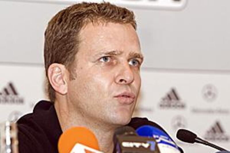 Oliver Bierhoff answers questions during a press conference in Dubai today.