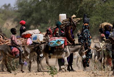 Sudanese refugees who fled the violence in Sudan's Darfur region ride their donkeys looking for space to temporarily settle near the border between Sudan and Chad in Goungour, Chad. Reuters