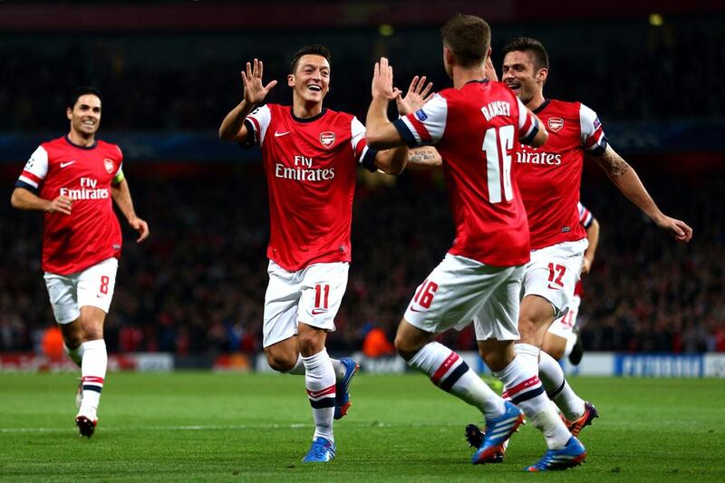 Arsenal may revisit the positions of Mesut Ozil and Aaron Ramsey to bolster the midfield. Paul Gilham / Getty Images