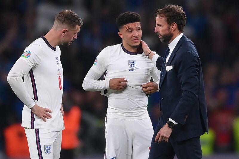 England manager Gareth Southgate, right, has said that Jadon Sancho, centre, has not been playing enough for his club Manchester United. AFP