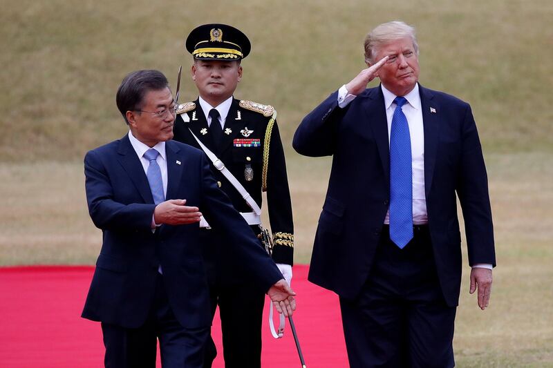 South Korean president Moon Jae-in and US president Donald Trump walk towards a guard of honour during a welcoming ceremony at the presidential Blue House in Seoul, South Korea. Chung Sung-Jun / EPA