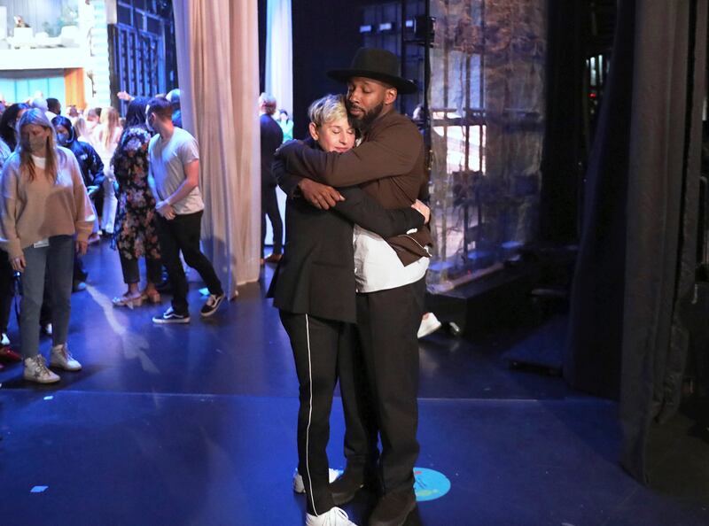 FILE - In this photo released by Warner Bros. , talk show host Ellen DeGeneres embraces Stephen "tWitch" Boss during a taping of "The Ellen DeGeneres Show" at the Warner Bros.  lot in Burbank, Calif.  Boss, a longtime DJ and co-executive producer on the talk show “The Ellen DeGeneres Show” and former contestant on the dance competition show, “So You Can Think You Can Dance” has died at the age of 40.  (Photo by Michael Rozman/Warner Bros. , File)