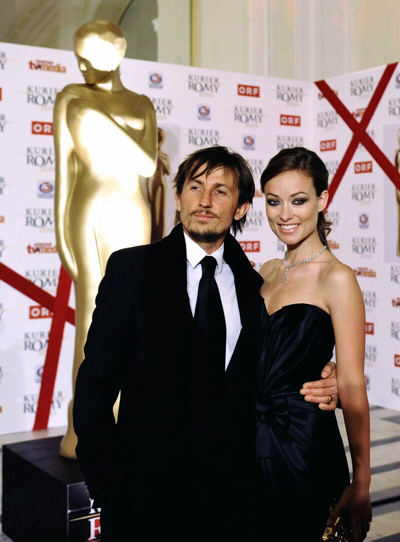 Olivia Wilde, in a black strapless sweetheart bust gown, and Tao Ruspoli arrive at the Romy Gala 2010 at the Hofburg Palace in Vienna, Austria, on April 17, 2010.