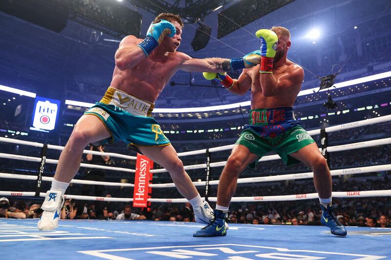Saul Alvarez throws a jab at Billy Joe Saunders during their super middleweight title fight at the AT&T Stadium. AFP