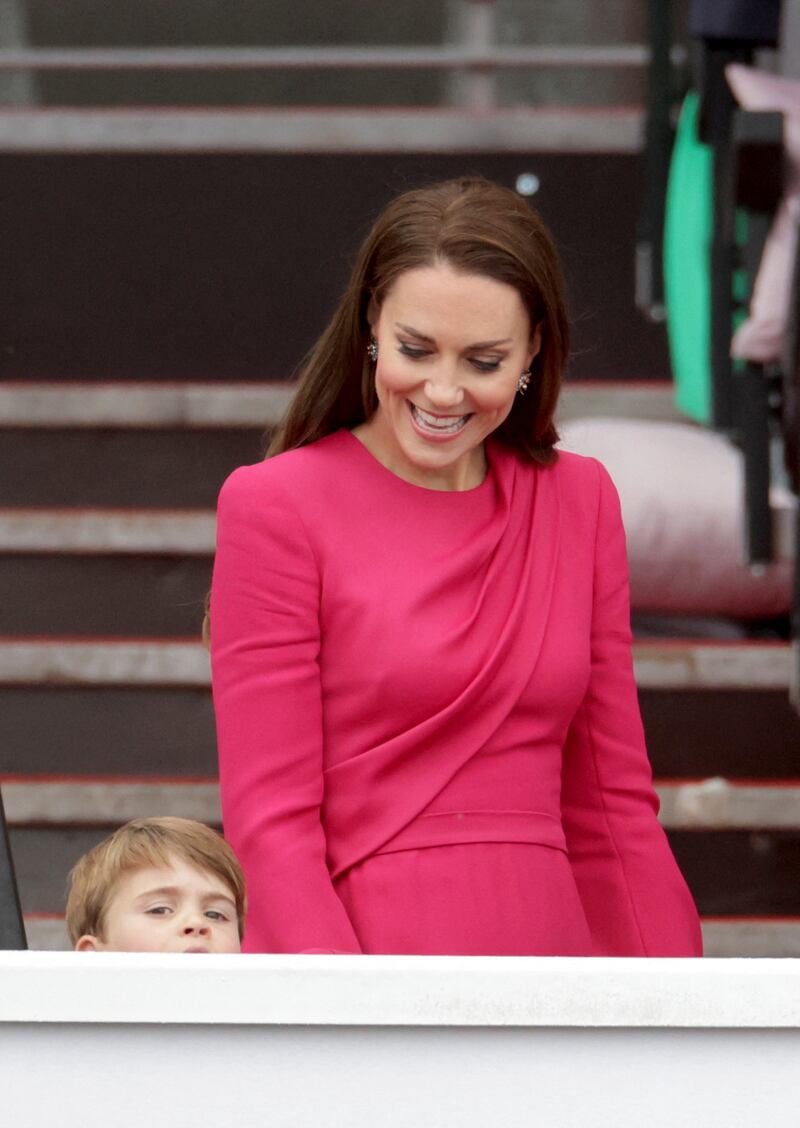 Kate, Duchess of Cambridge, wearing a pink Stella McCartney drape dress, with Prince Louis at the platinum jubilee pageant, marking the end of celebrations, on June 5. Reuters 